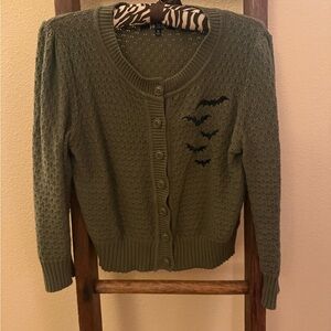 Green Knit Sweater with Bat Design